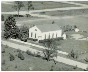 Our church building in its original location at a distance